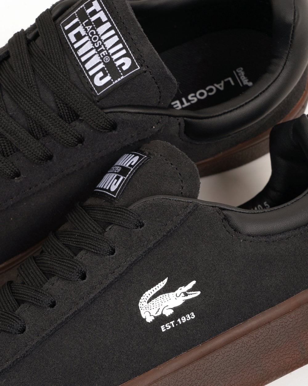 Lacoste Baseshot trainers in black and dark gum.